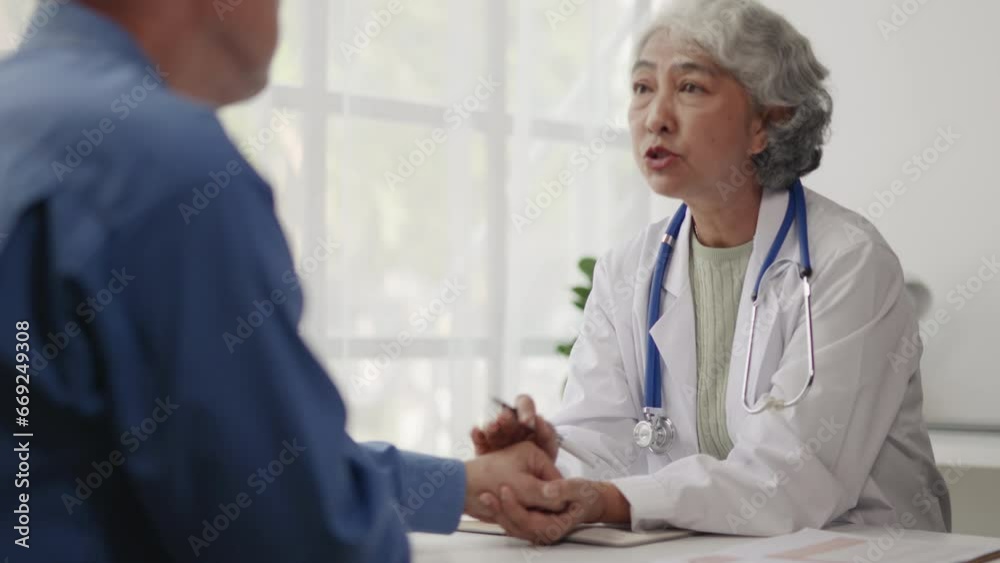 Doctor is advised treatment methods and recovery then touching patient hands for encouragement and support to old man patient. Doctor is advised treatment methods and recovery then touching patient hands for encouragement and support to old man patient.