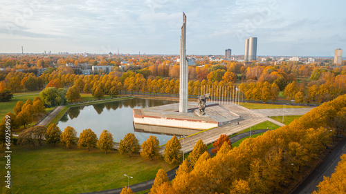 Aerial photo from drone to of Victory Monument In Riga (Uzvaras Piemineklis), golden autumn. World War II Victory Monument to Soviet Army in Riga. Riga, Latvia, Europe  

 photo
