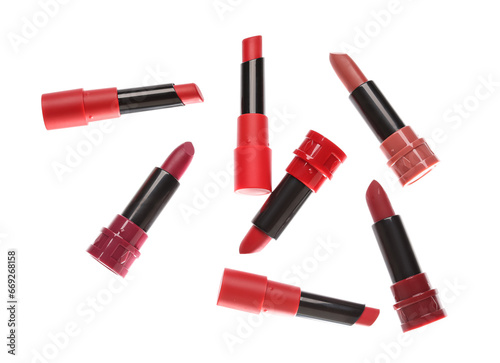 Different bright lipsticks on white background