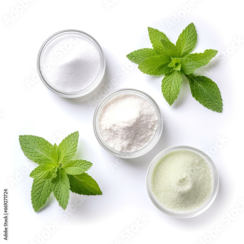 Set of different stevia sweeteners in powder, with leaves isolated separately on white background, top view