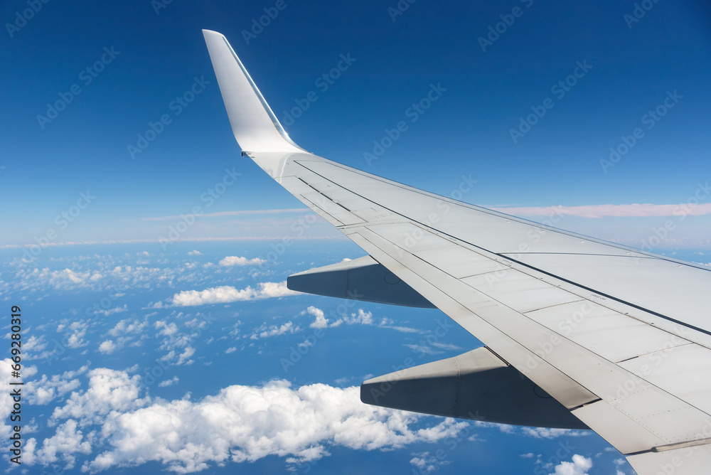 Aircraft wing against blue sky Aircraft wing against blue sky