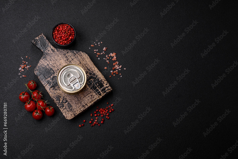 Round metal can with canned fish or meat with a key Round metal can with canned fish or meat with a key