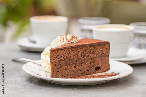 Photography Slice of Sacher Torte cake on plate at Cafe in Vienna, Austria.