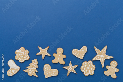 Cute homemade Christmas cookies on color background,top view