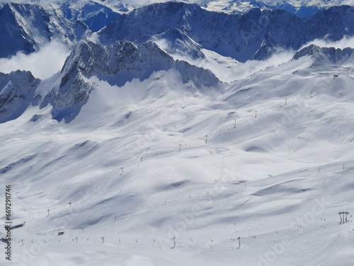 Ski resort on a clear Sunny day. Snow on the Zugspitze mountain height -2962 m. in Bavaria  Germany