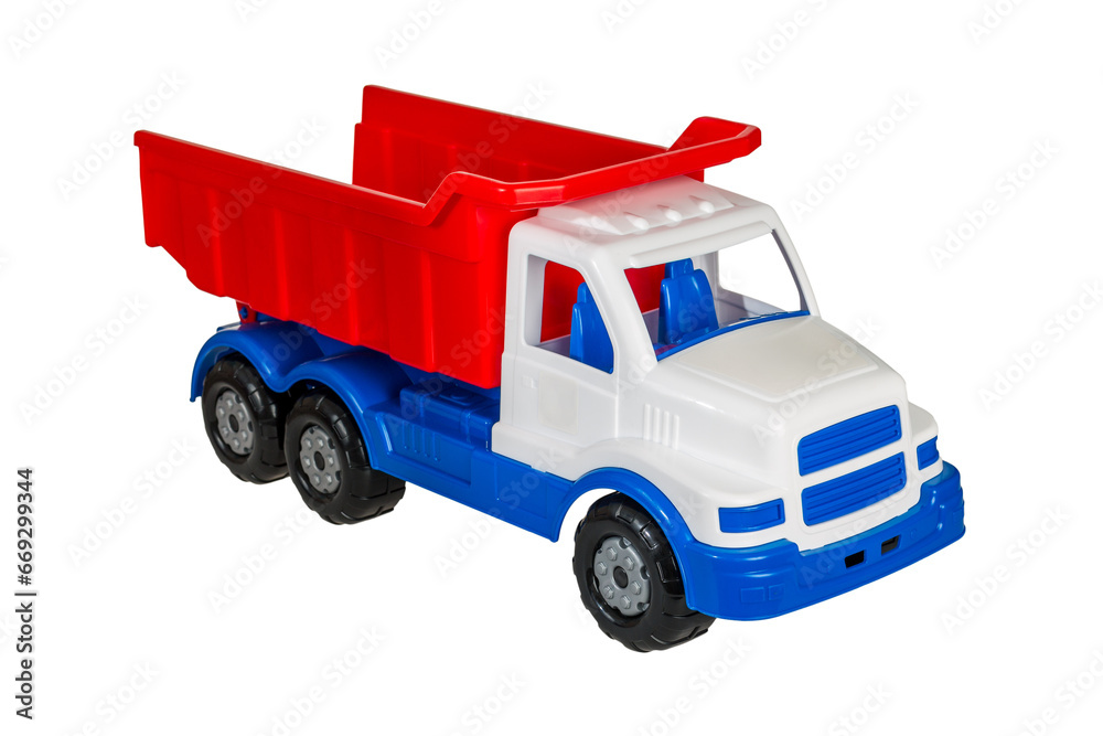 Children's toy plastic big dump truck with a folding body isolated on a white background