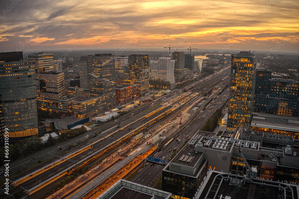 Aerial View of the Business District of Amsterdam along the Train Station at Sunset