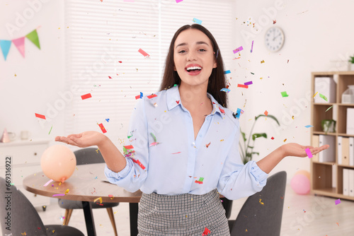 Young woman having fun during office party indoors