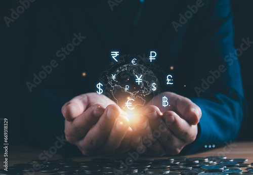 Currency exchange and international money transfer concept. Businessman hand holding virtual global currency exchange, foreign currency, international money transfer, financial online banking payment.