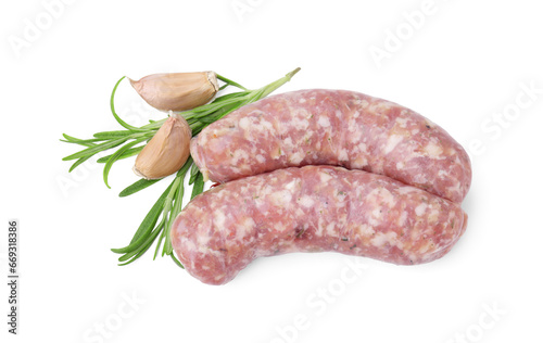 Raw homemade sausages, rosemary and garlic isolated on white, top view