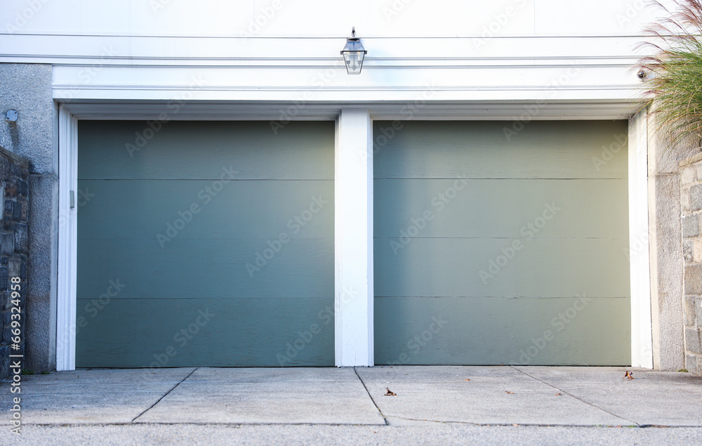 garage door stands tall, symbolizing security and convenience. A gateway to shelter cars and storage, it complements the home's aesthetic while ensuring protection garage door stands tall, symbolizing security and convenience. A gateway to shelter cars and storage, it complements the home's aesthetic while ensuring protection