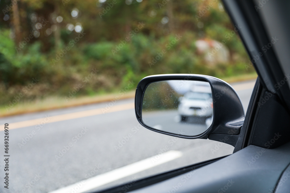 car mirror reflects the past, capturing memories, nostalgia, and the road traveled, symbolizing self-reflection, journeys, and moments that have passed