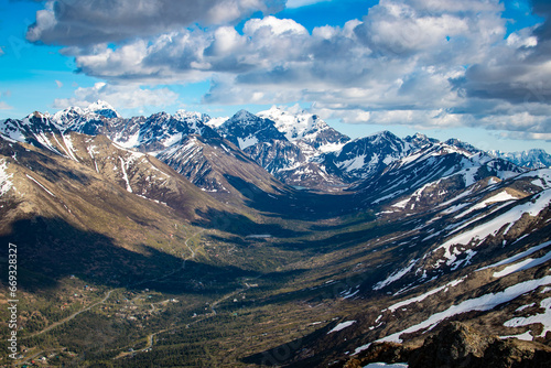 Heavy cloud shadows on a glacial valley in Chugach State Park Alaska