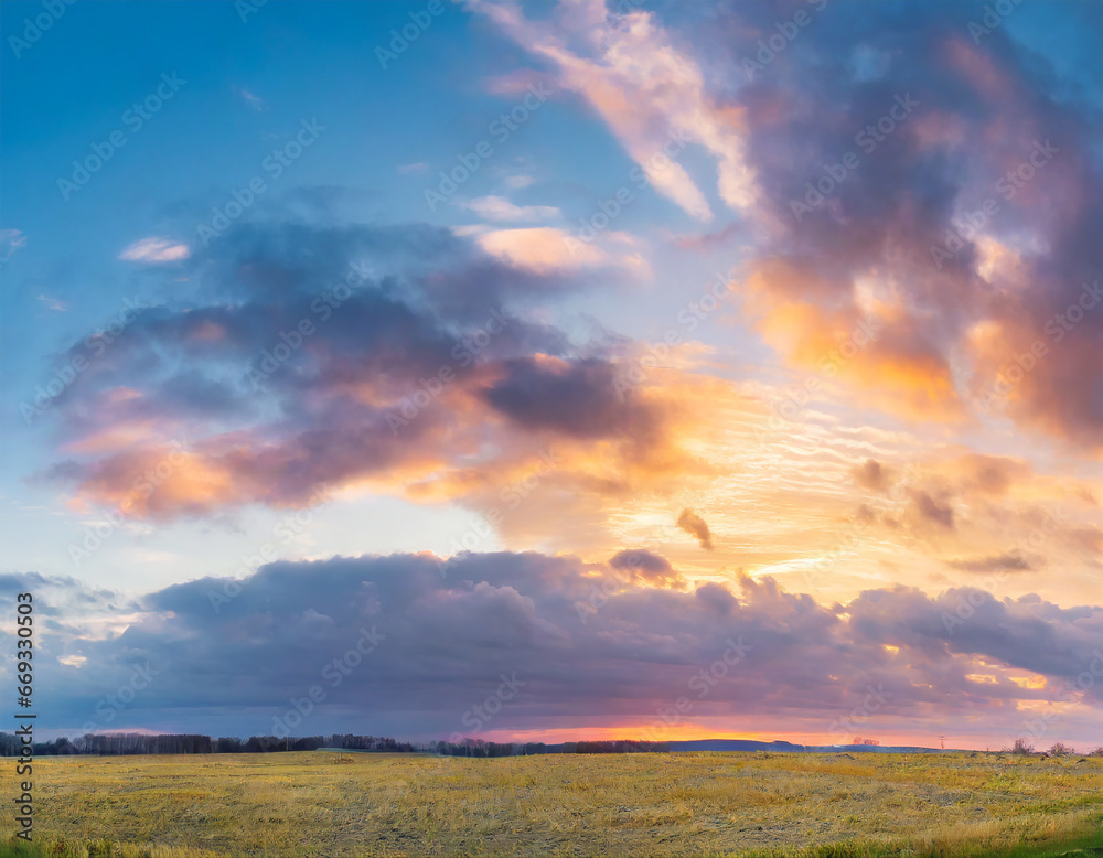 Fototapeta premium Beautiful panoramic sky with glowing clouds at sunset