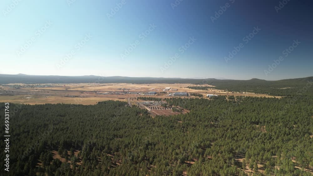 Aerial above pine trees in Coconino National Forest next to I-40 in Flagstaff Aerial above pine trees in Coconino National Forest next to I-40 in Flagstaff