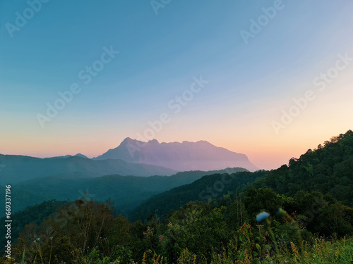 The horizon dawn light hit the top of the mountain to display beautiful sight