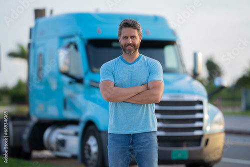 Hispanic driver near lorry truck. Man owner truck driver. Handsome hispanic man trucker trucking owner. Transportation industry vehicles. Handsome man driver front of truck.