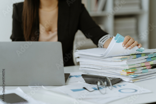 business documents businessman check legal document review Prepare documents or analysis reports, tax items, accounting documents, data contracts, office partner agreements.

