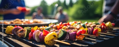 Vegetable kebabs on an outdoor grill at a party in summertime