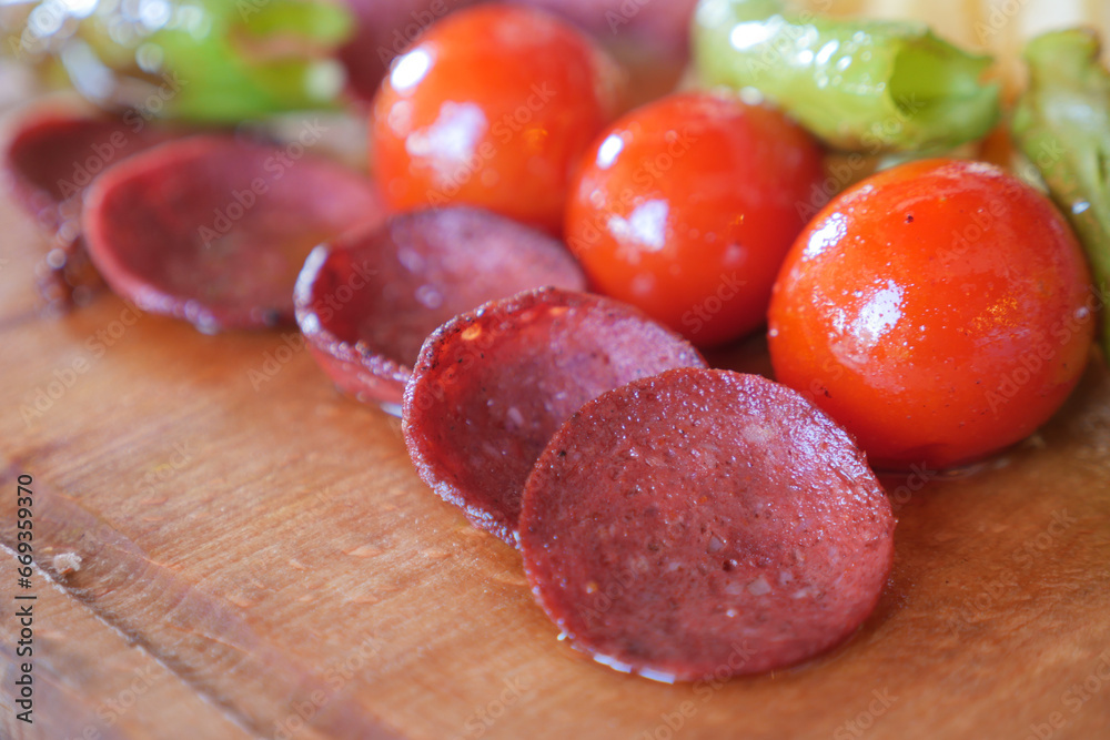smoked salami sausage and tomato meal on table smoked salami sausage and tomato meal on table