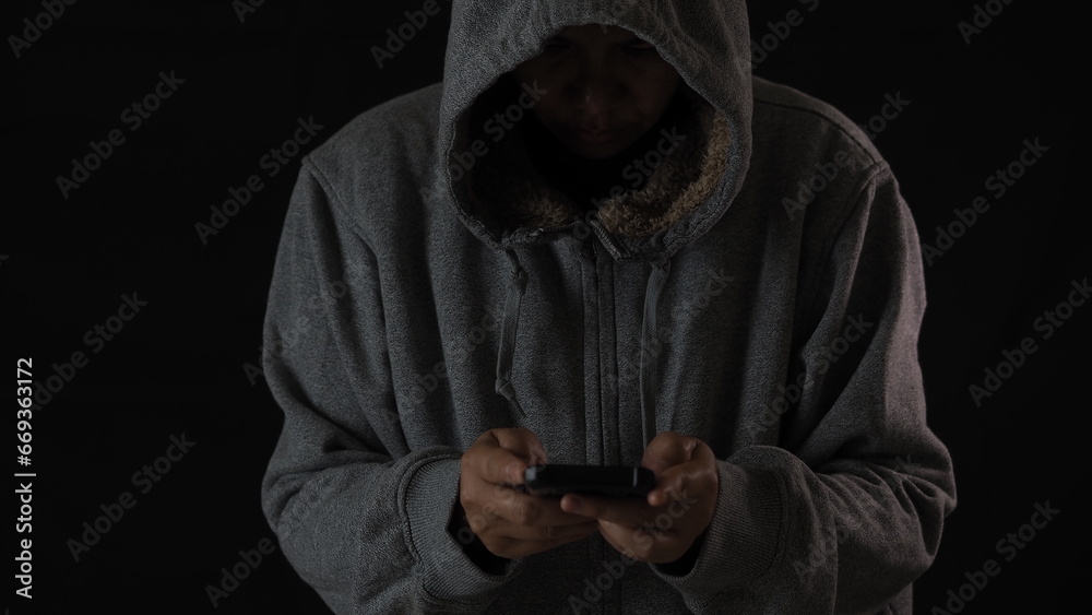 Hacker and light on mobile phone screen, Hacker attacking internet Hacker and light on mobile phone screen, Hacker attacking internet