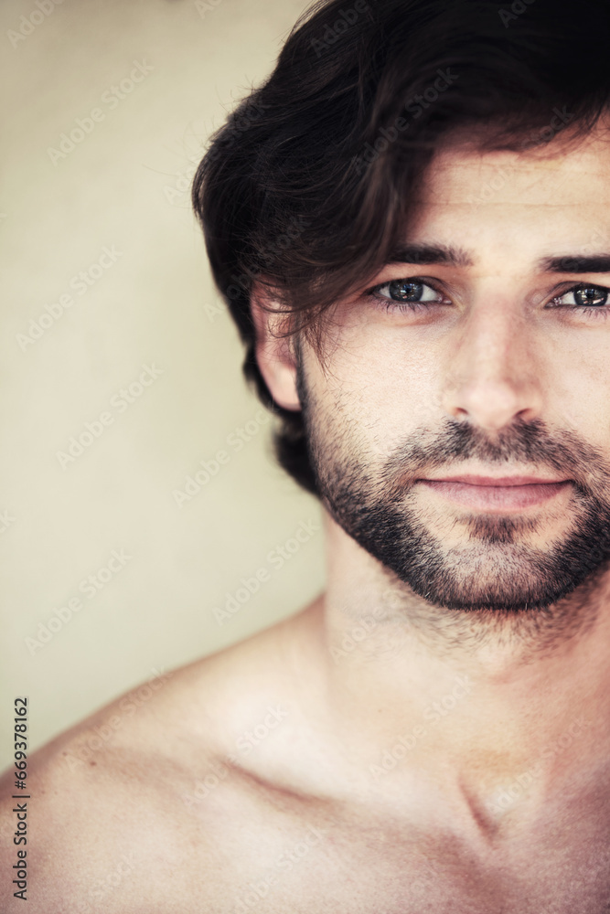Obraz premium Skincare, portrait and man in studio for beauty, wellness or cosmetic treatment on wall background. Face, confident and guy model with dermatology, facial hair or grooming routine result satisfaction