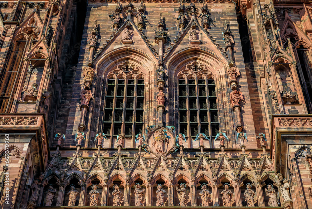 Ornate Gothic facade of the Notre Dame Cathedral in Strasbourg, Alsace, France, one of the most beautiful Gothic cathedrals in Europe, at sunset