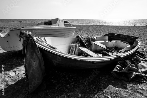 Abandoned fishing boat on the beach in Spain photo