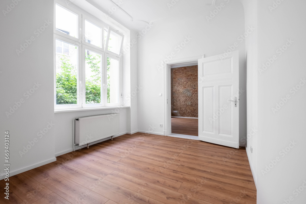 empty flat, unfurnished room after renovation with big window empty flat, unfurnished room after renovation with big window
