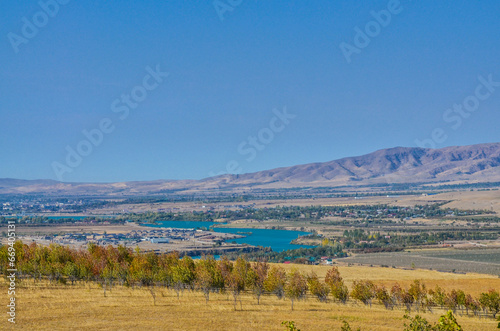 scenic view of Chirchiq river valley and Korzhantau ridge from Karanul village (Tashkent region, Uzbekistan) photo