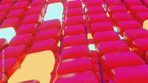 Empty red plastic seats in rows curve around a large outdoor sports stadium