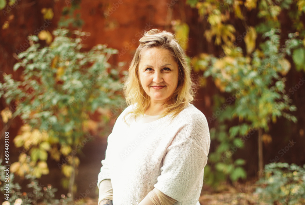 street autumn portrait of a blonde woman of European appearance, selective focus street autumn portrait of a blonde woman of European appearance, selective focus