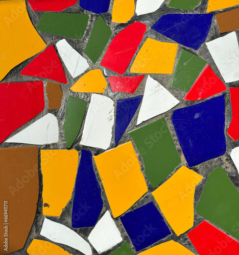 Broken tile mosaic or Trencadis close-up, white, blue, red, green, yellow and brown tiles, Playa de Las Americas, Tenerife, Canary Islands, Spain 