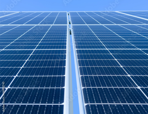 Blue Solar panel background texture. Solar panels pattern for sustainable energy over blue sky. Renewable solar energy. Alternative energy.