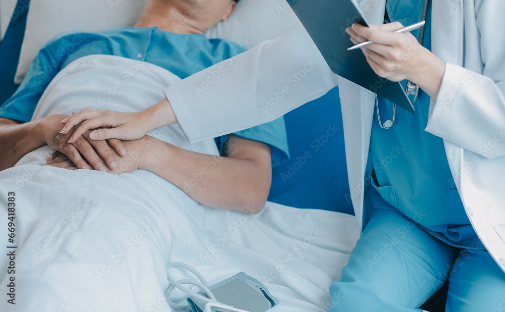 Fototapeta premium Injured patient showing doctor broken wrist and arm with bandage in hospital office or emergency room. Sprain, stress fracture or repetitive strain injury in hand. Nurse helping customer. First aid.