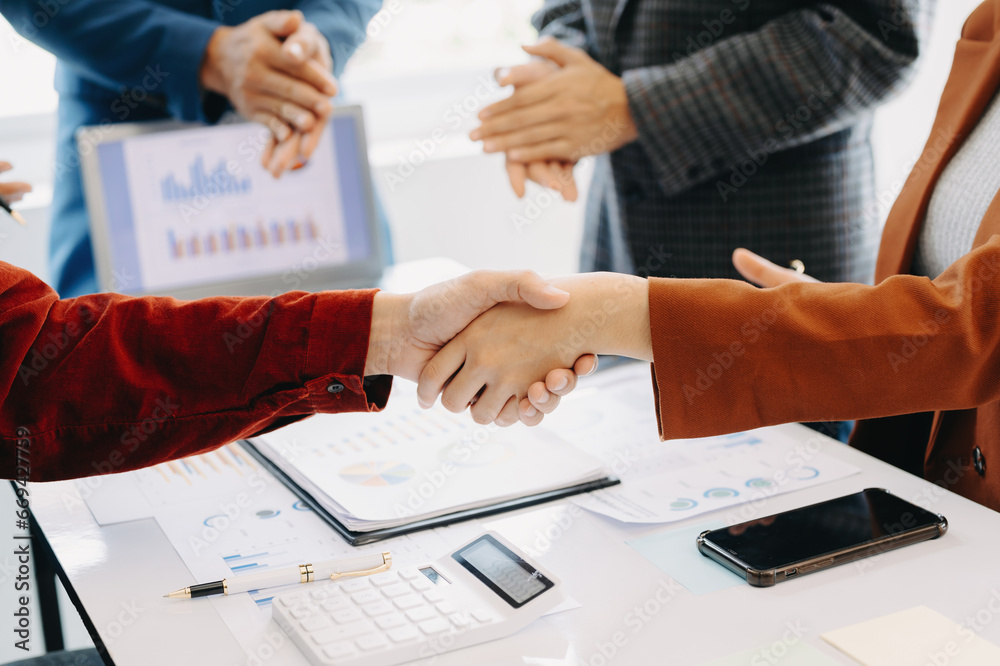 Two confident business man shaking hands during a meeting in the office, success, dealing, greeting and partner