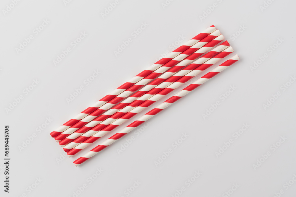 Bunch of red striped paper straw on white Bunch of red striped paper straw on white