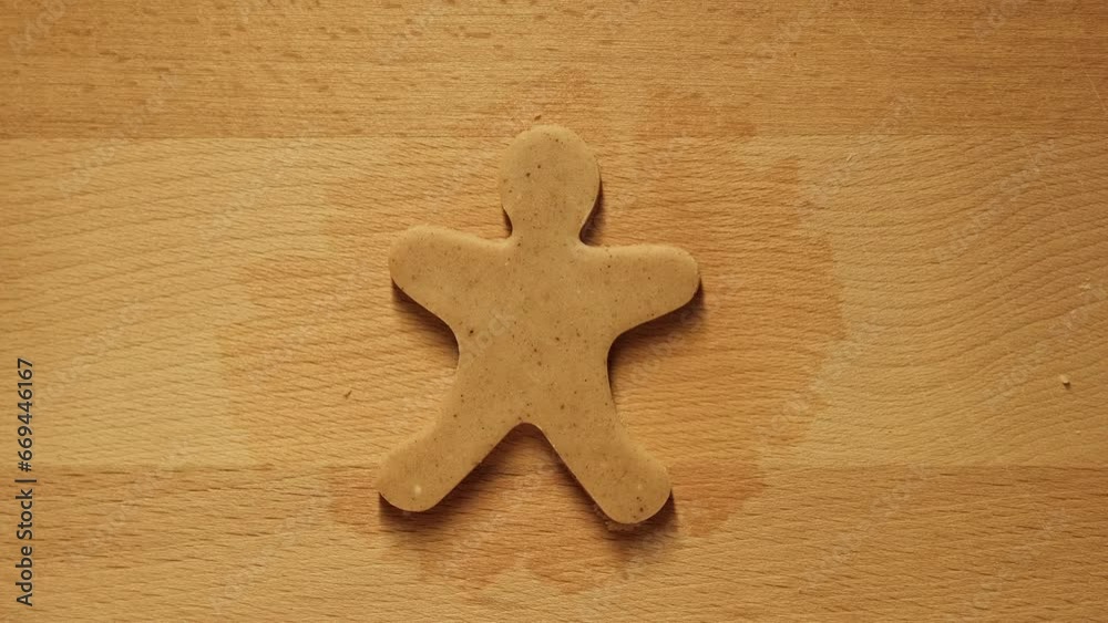 Man making gingerbread cookie. Christmas and New Year concept. Male hands cutting ginger dough with cutter to making cookies for winter holidays. Close-up in 4K, UHD Man making gingerbread cookie. Christmas and New Year concept. Male hands cutting ginger dough with cutter to making cookies for winter holidays. Close-up in 4K, UHD