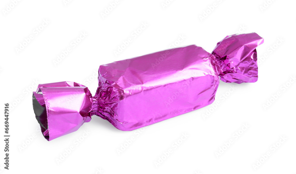 Tasty candy in violet wrapper isolated on white Tasty candy in violet wrapper isolated on white