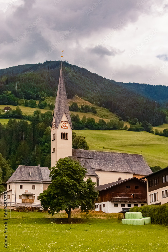 Church on a cloudy summer day at Stuhlfelden, Upper Pinzgau, Zell am See , Salzburg, Austria Church on a cloudy summer day at Stuhlfelden, Upper Pinzgau, Zell am See , Salzburg, Austria