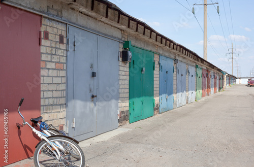 Shed. Colored barn doors. Garages and bike. Parking for cars