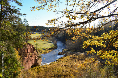 Zvartes rock and Amata river in autumn day photo