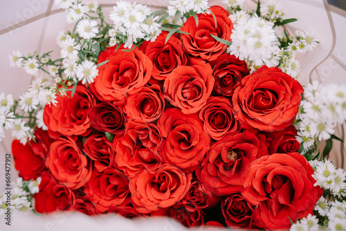 red roses in the form of a bouquet as a sign of proposing to someone he loves