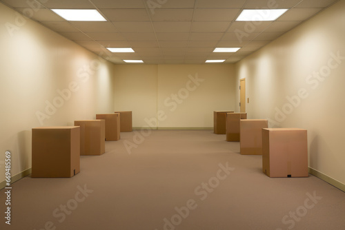 Empty office room or corridor with cardboard boxes photo