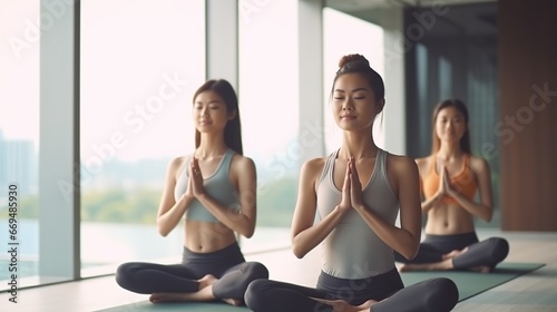 Yoga class, meditation group of women doing exercises for fitness