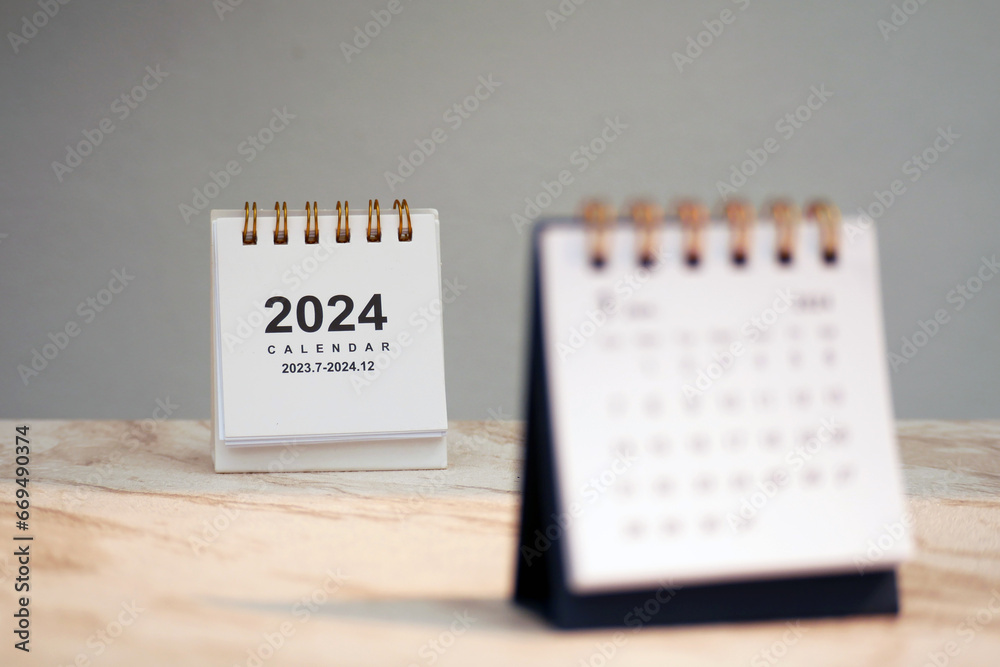 Calendar page January of the year 2024 white color on a white marble ...