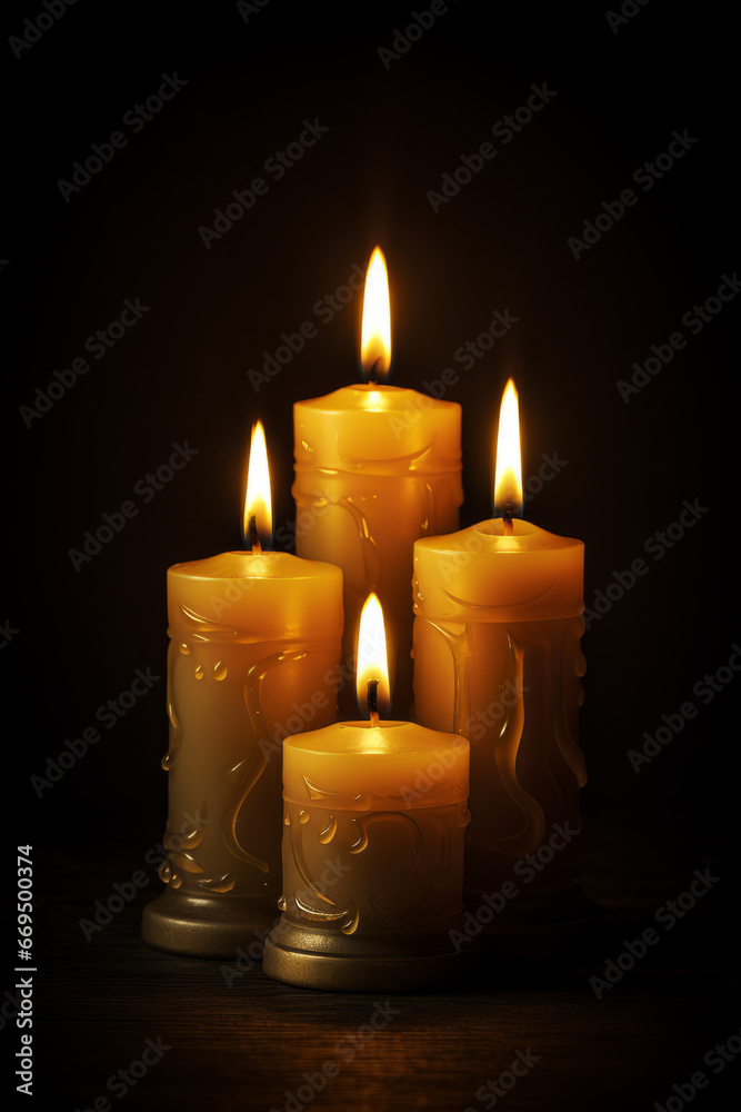 Group of four candle lights, with dark background, with space for text Group of four candle lights, with dark background, with space for text