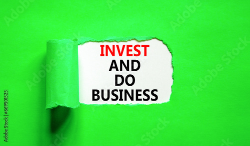 Invest and do business symbol. Concept word Invest and do business on beautiful white paper. Beautiful green paper background. Invest and do business concept. Copy space.