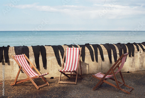 wet suits on sea wall