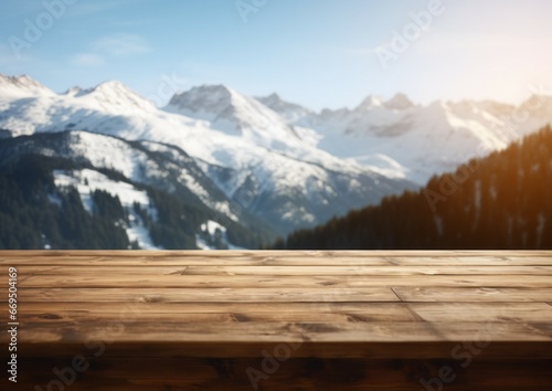 Empty wood wooden table top with blur background of Alpine with snow capped for display product